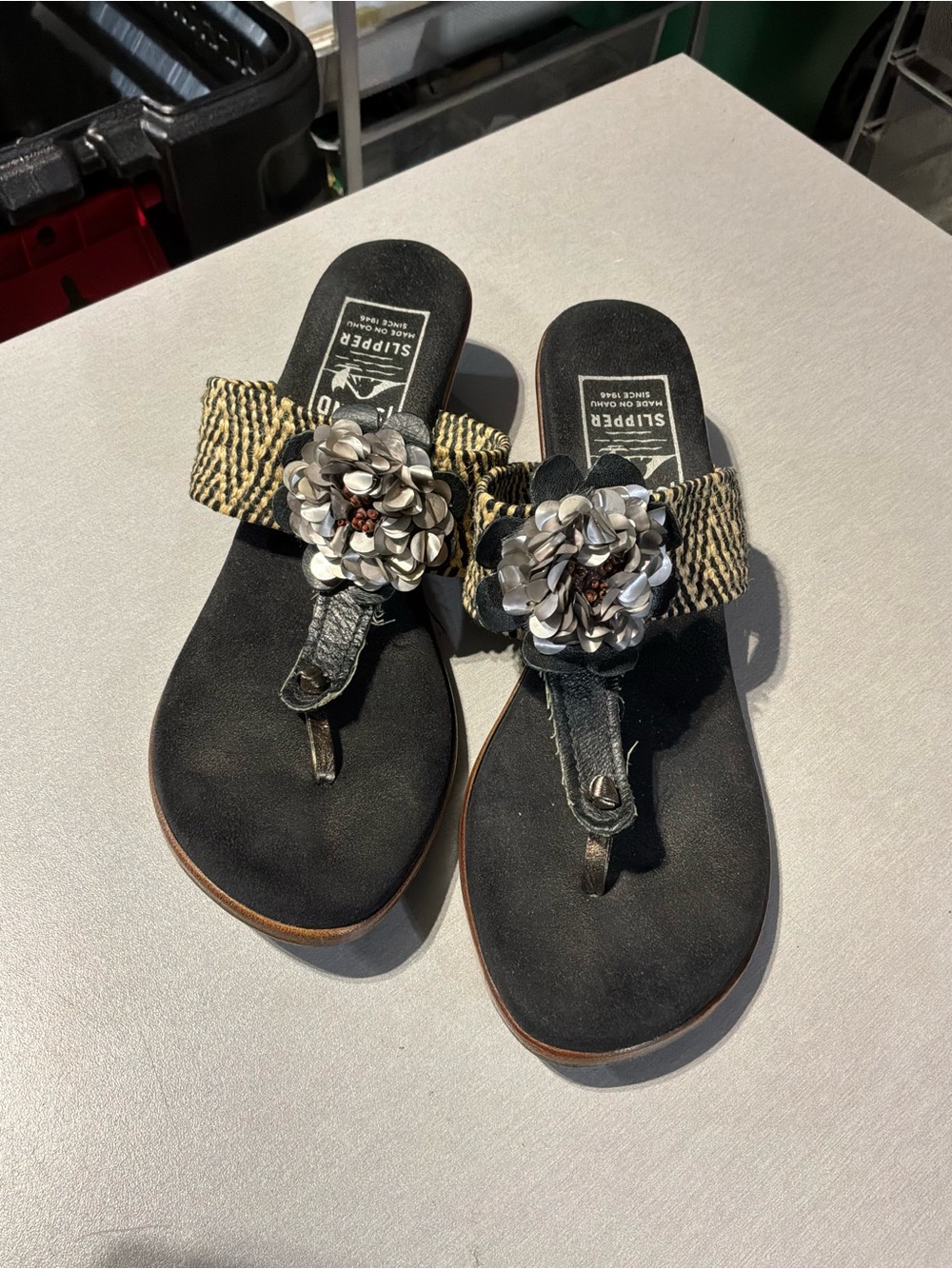 Floral-Embellished Black Thong Sandals with Woven Strap